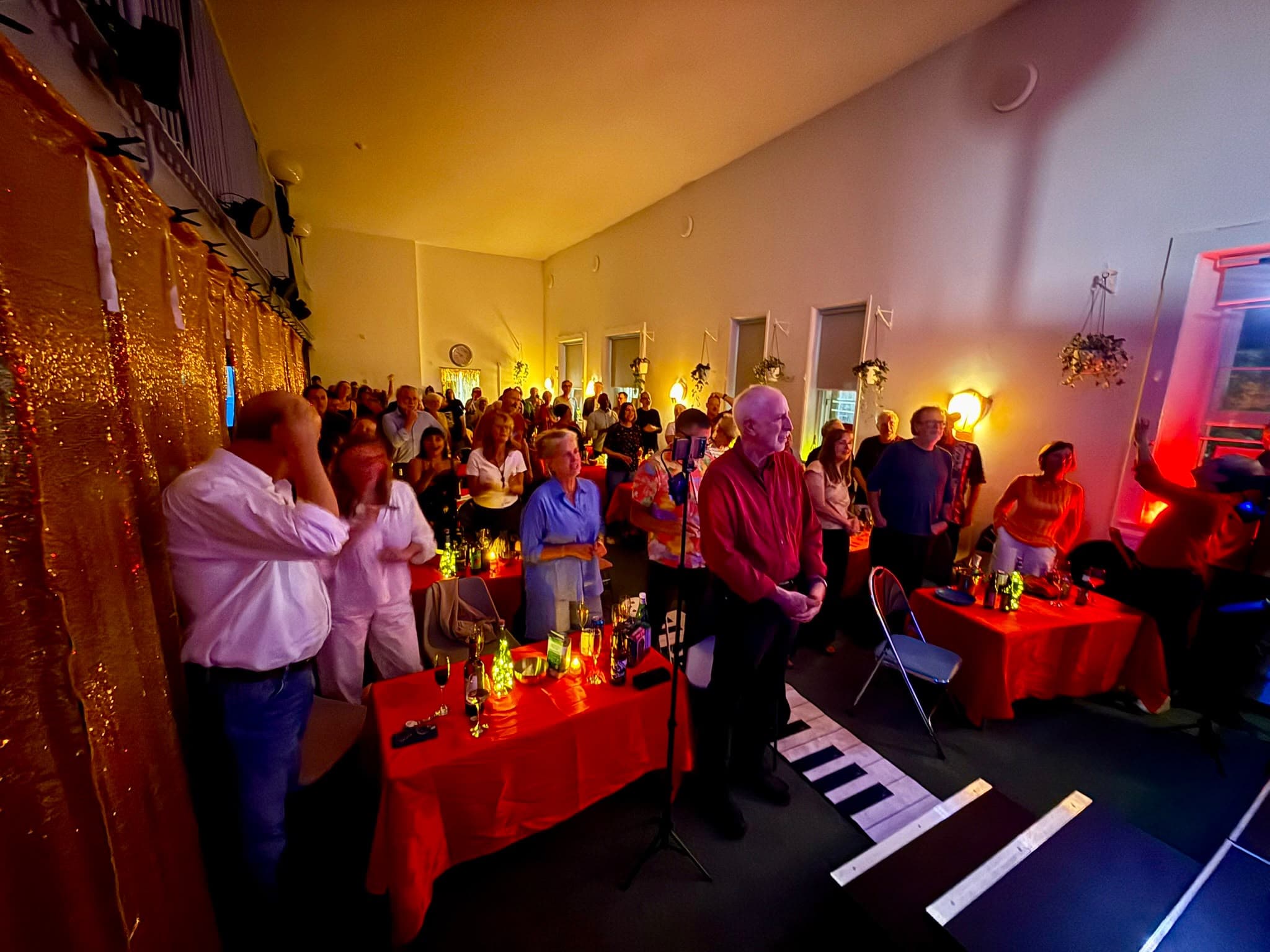 The audience standing to applaud at Pop Up Jazz Club