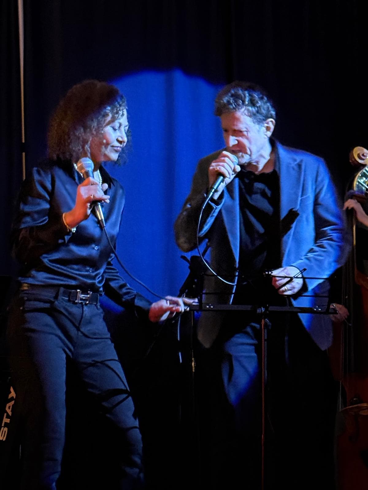 Two local singers performing a duet on stage