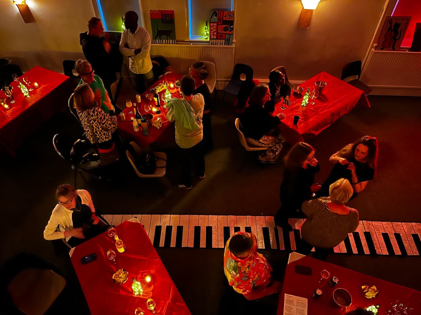 Candlelit tables in a warmly lit room
