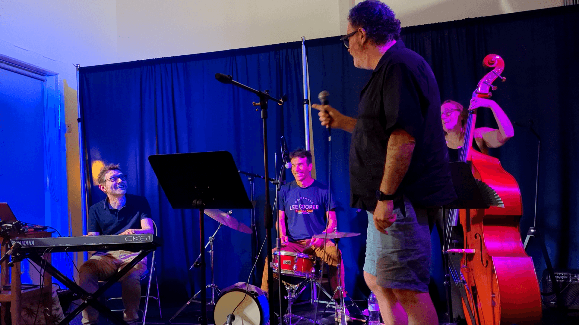 Singer and house band together on stage